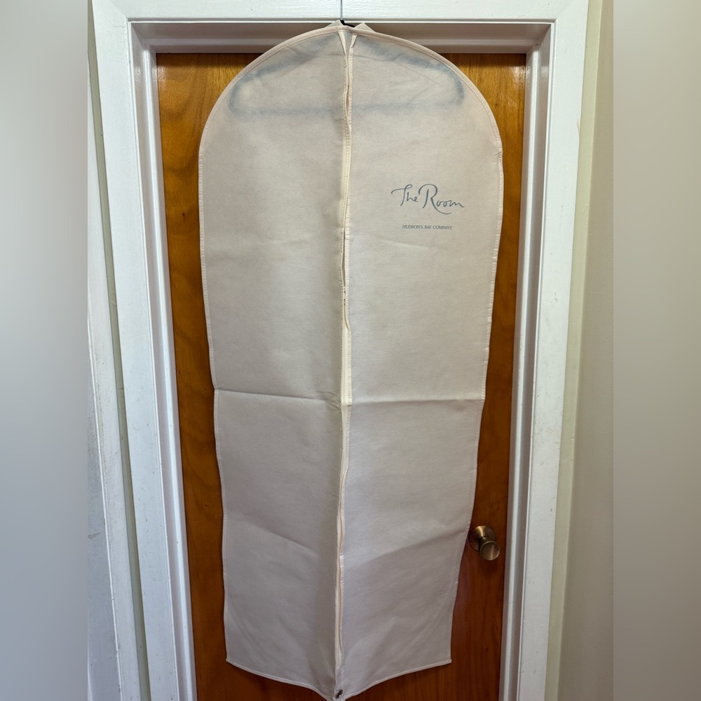 Hudson's Bay **THE ROOM** garment bag in a cream color. 
**BRAND NEW**